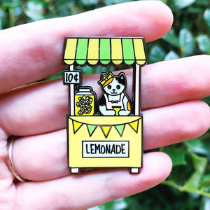 Lemonade stand cat enamel pin