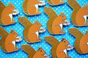 Sewing squirrel enamel pin