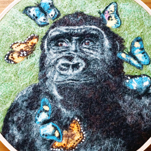 Wool painting of gorilla with butterflies